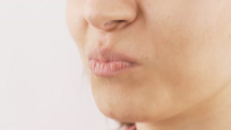 Close-up-of-woman-eating-watermelon-jelly.