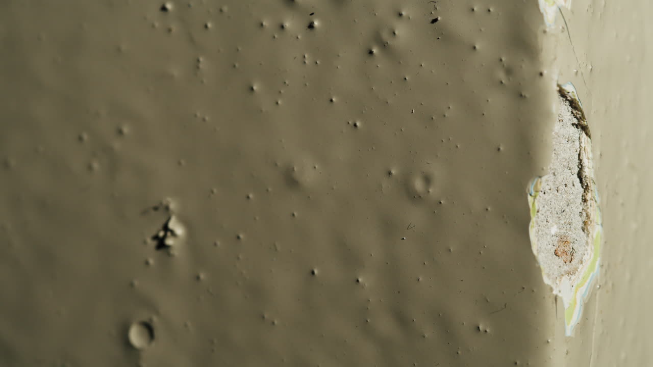 Damaged paint on a wall corner