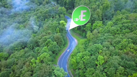 electric car driving through green trees to charging station