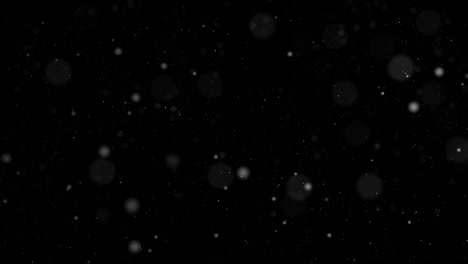 falling snow, snowflakes isolated on background with alpha channel.  4k animation for christmas or new year celebration, digital composition. slow motion graphics, shimmering particles with bokeh.