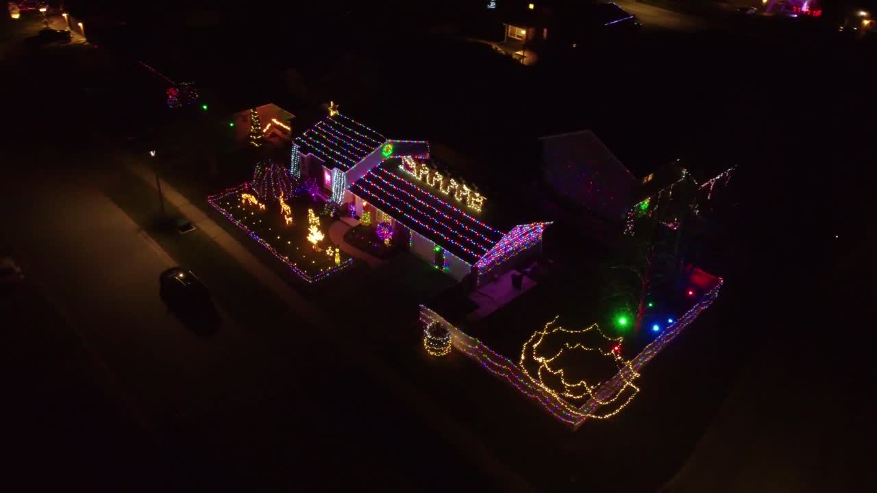 Christmas decorated homes in a city at night
