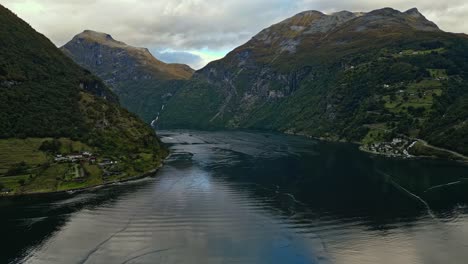 Aerial-over-the-village-of-Gieranger-at-the-head-of-the-Geirangerfjord,-Norway