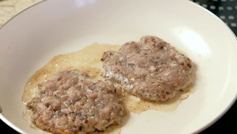 frying on the pan cutlets for burgers. close-up.