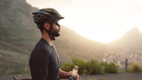 Fitness,-break-and-man-cyclist-drinking-water