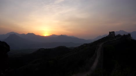 marvellous sunset in the ancient chinese great wall surrounded by mountains