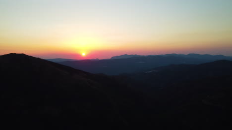 distant sunsets last light in the mountains near estepona, spain