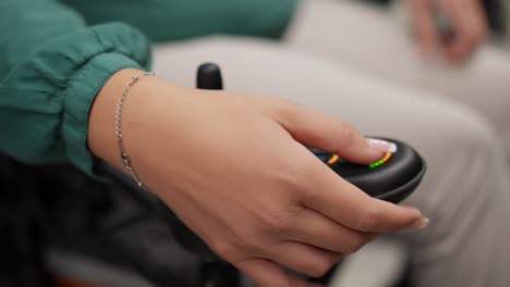 hand controlling wheelchair joystick