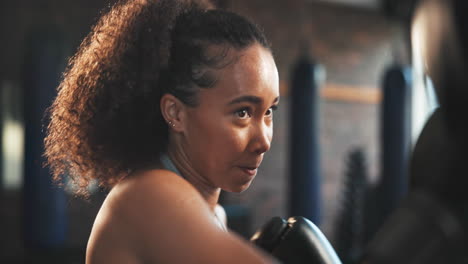 sports, woman face and boxer punch training