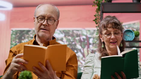 Elderly-man-and-woman-enjoying-lecture-hobby-together-at-home