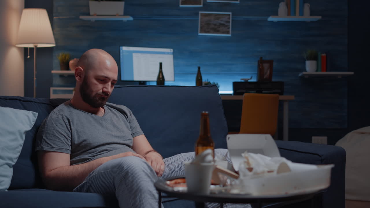 Frustrated upset, depressed man looking at camera lost in phychotic thoughts