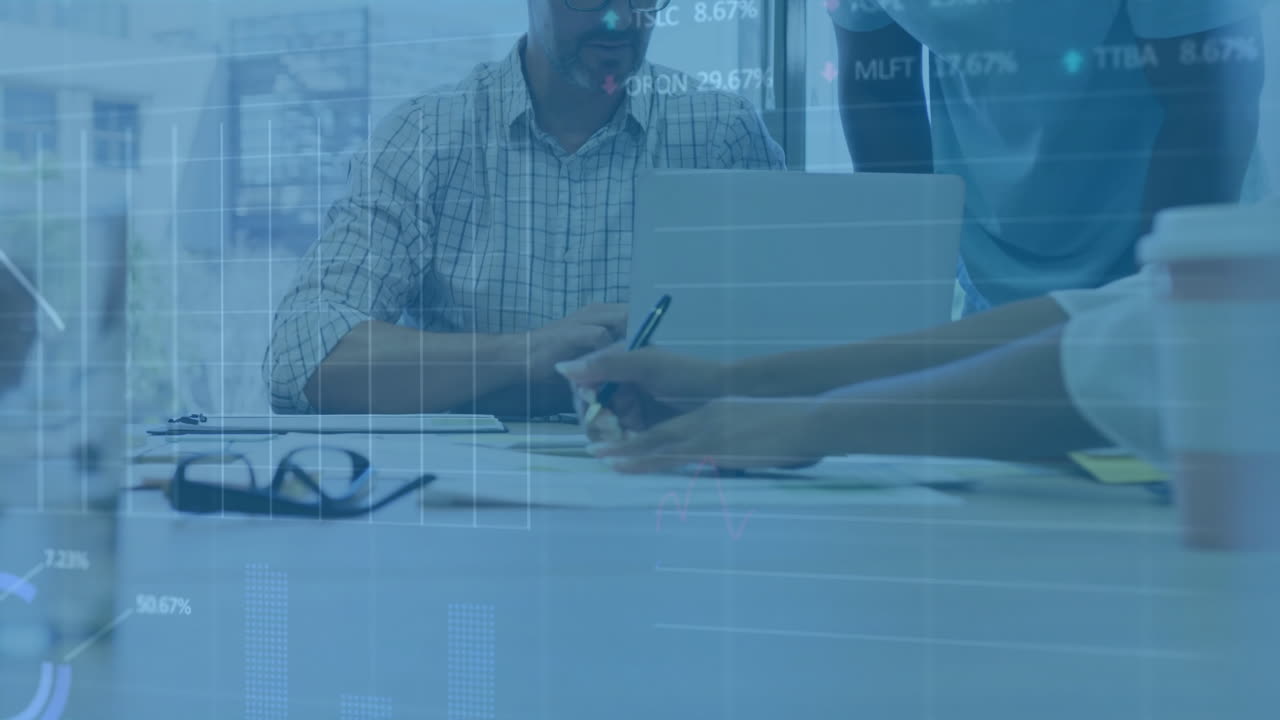 Animation of financial data processing over diverse colleagues discussing work in office