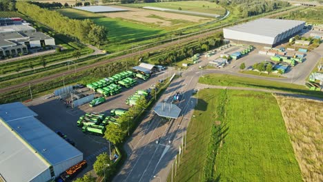 Jib-down-of-parked-garbage-trucks-on-a-large-landfill-in-summer