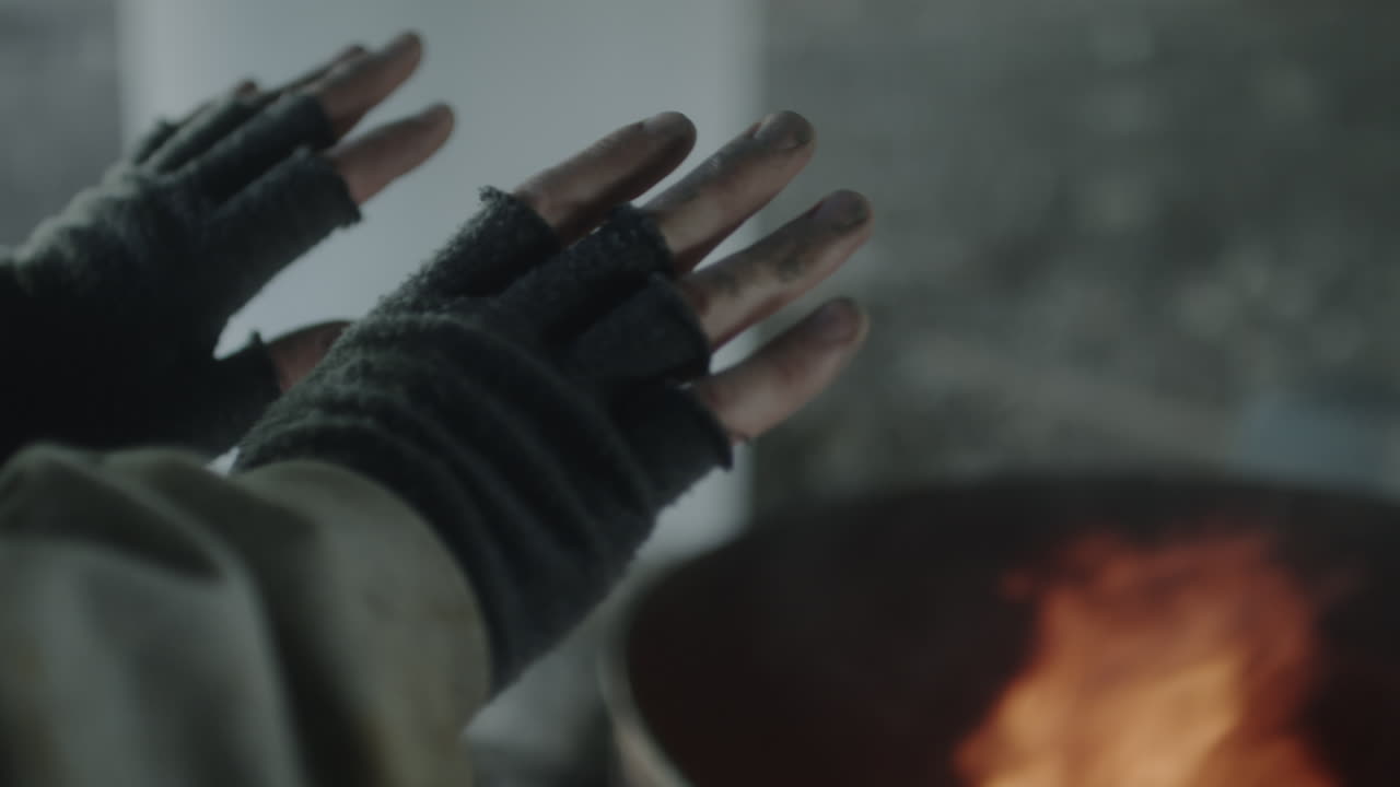 Hands Warming by a Fire