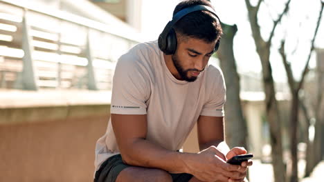 Bench,-man-and-phone-for-music-with-headphones