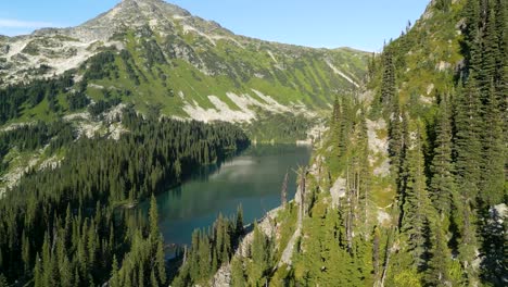 revealing blue lake behind the mountain ridge