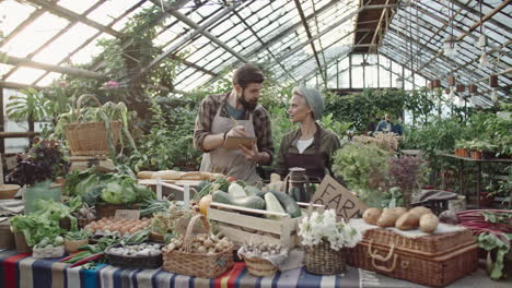 Two-Employees-Of-A-Grocery-Serve-Customers-In-Shop