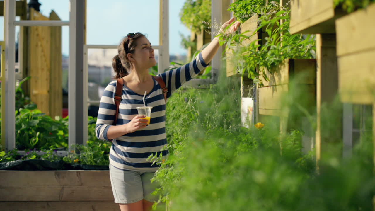 Woman in city farm shopping for plants