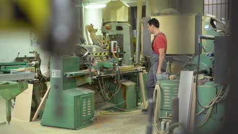man working with wood in a workshop