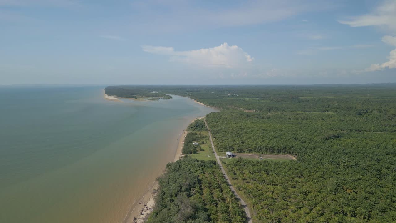 Aerial Drone View During Summer Alit Fishing Village,Kabong With, Facing Open Blue Sea, White Sandy Beach,Green Coconut, Palm Trees,And River,Sarawak,Borneo