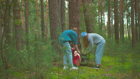 hikers zip up their bags in lush forest scenery, preparing for outdoor adventure, surrounded by tall trees and vibrant greenery, they securely close their bags and prepare to continue their hike