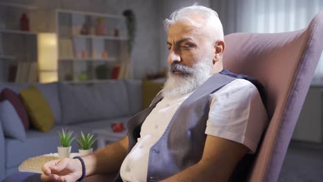 lonely abandoned gray haired bearded man is bored.