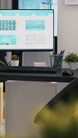 vertical video empty company financial department with stock portfolio on computer monitor