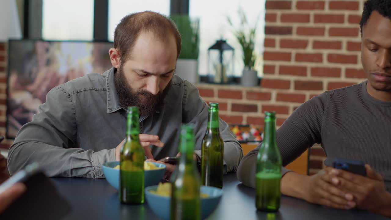 Young man hanging out with friends and browsing internet