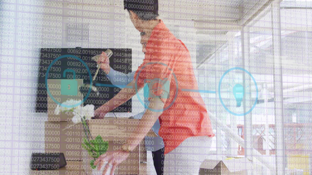 una vista de dos personas trabajando en una oficina moderna, moviéndose y desempaquetando cajas