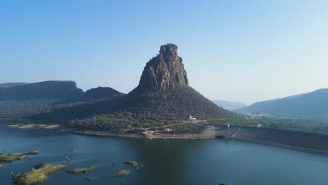 aerial view of karamchat dam at sunset, with the golden hues reflecting off the calm waters.