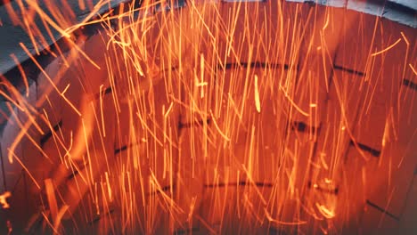 brick pipe of a blast furnace with a bright burning hearth and flaming sparks