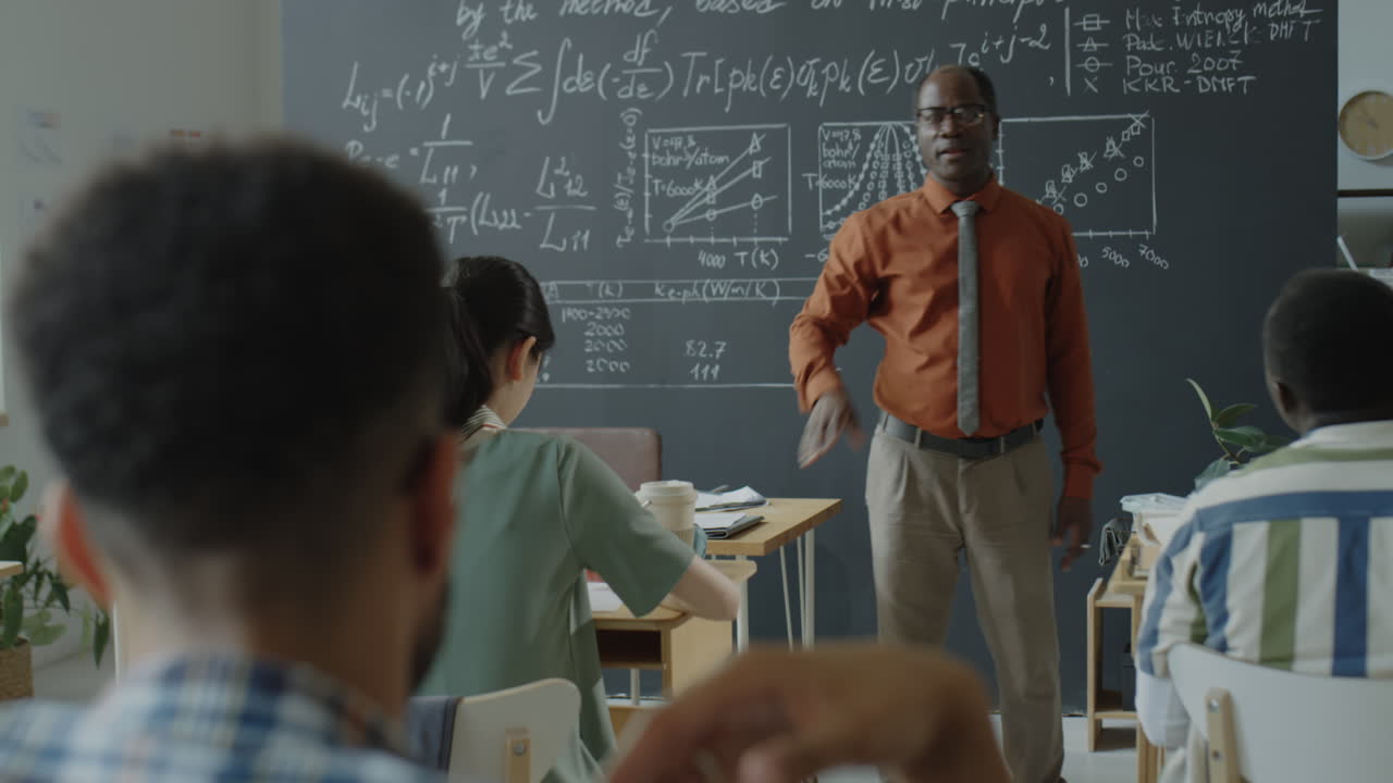 University Professor Teaching a Diverse Group of Students in a Classroom