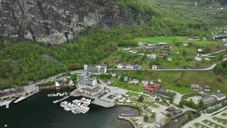 town and seafront of geiranger norway - beautiful wide angle establishing shot with river, hotels and marina