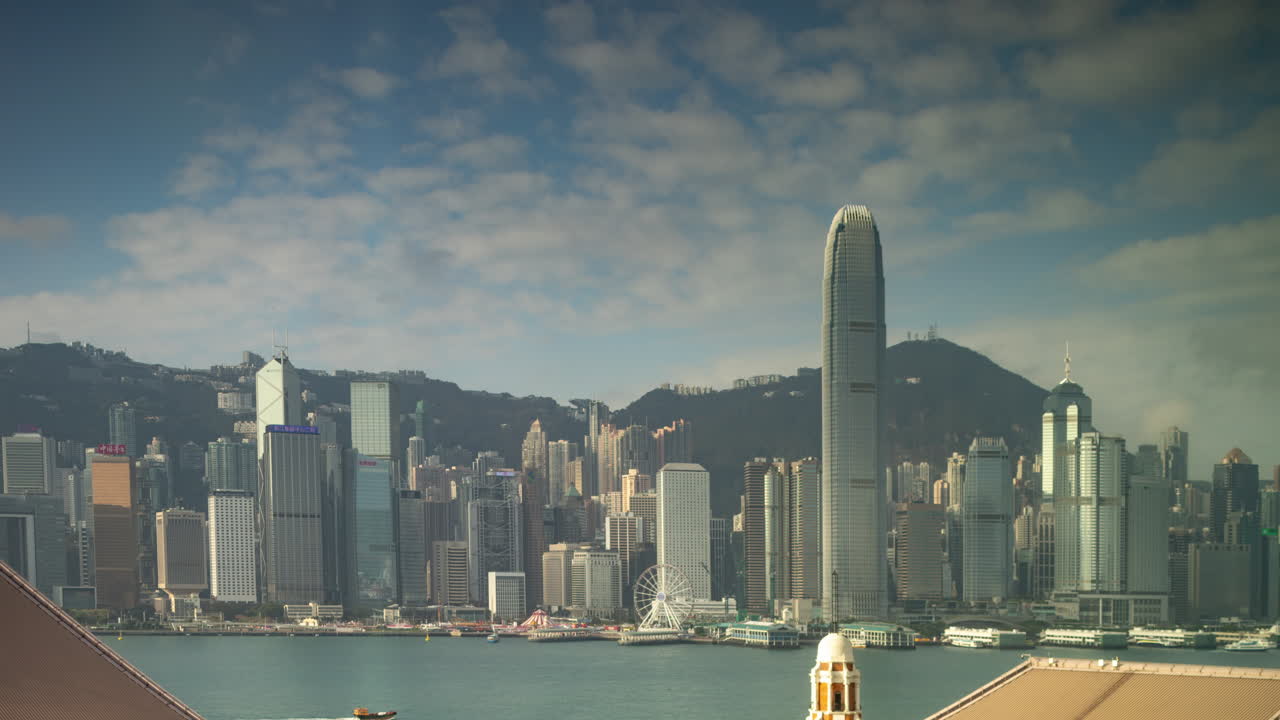 HONG KONG - 19 MARCH 2025 : Hong Kong Central skyline timelapse filmed from across the harbour in kowloon