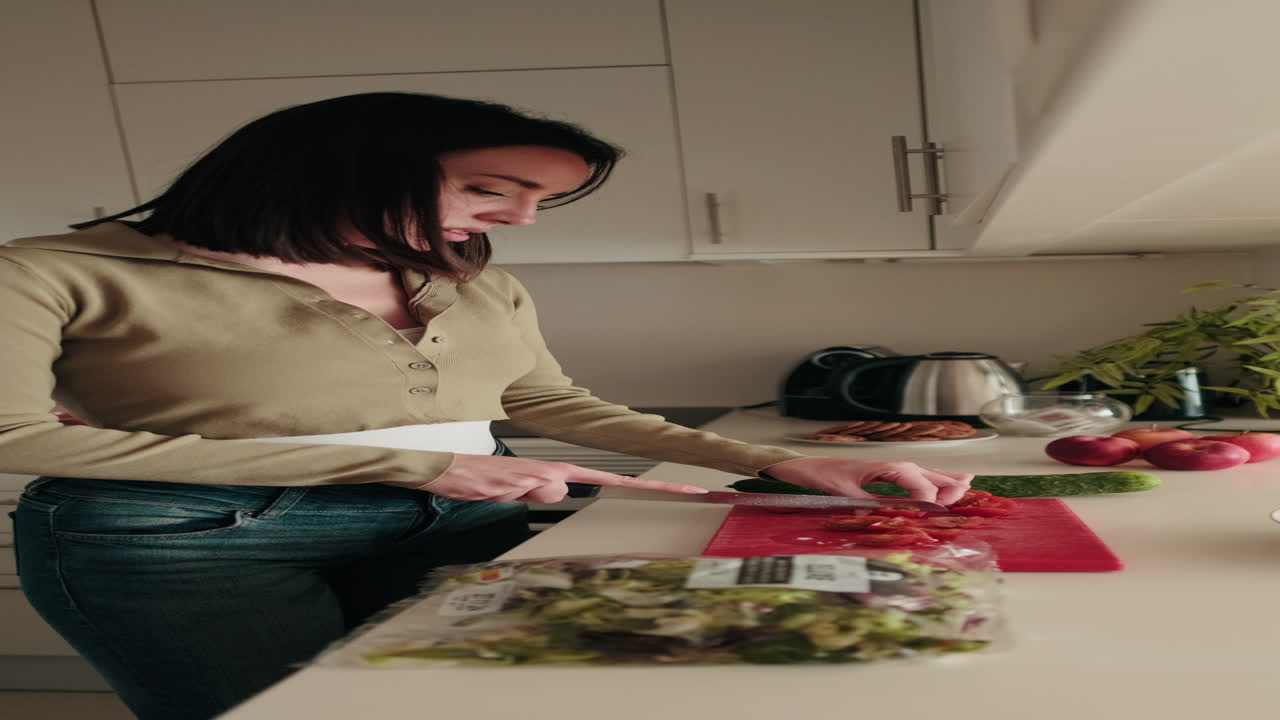 Woman Making Healthy Salad in Kitchen. Foodblog
