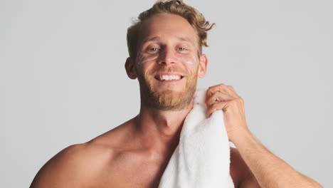 handsome strong guy with eye patches and towel