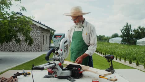 senior carpenter working outdoors