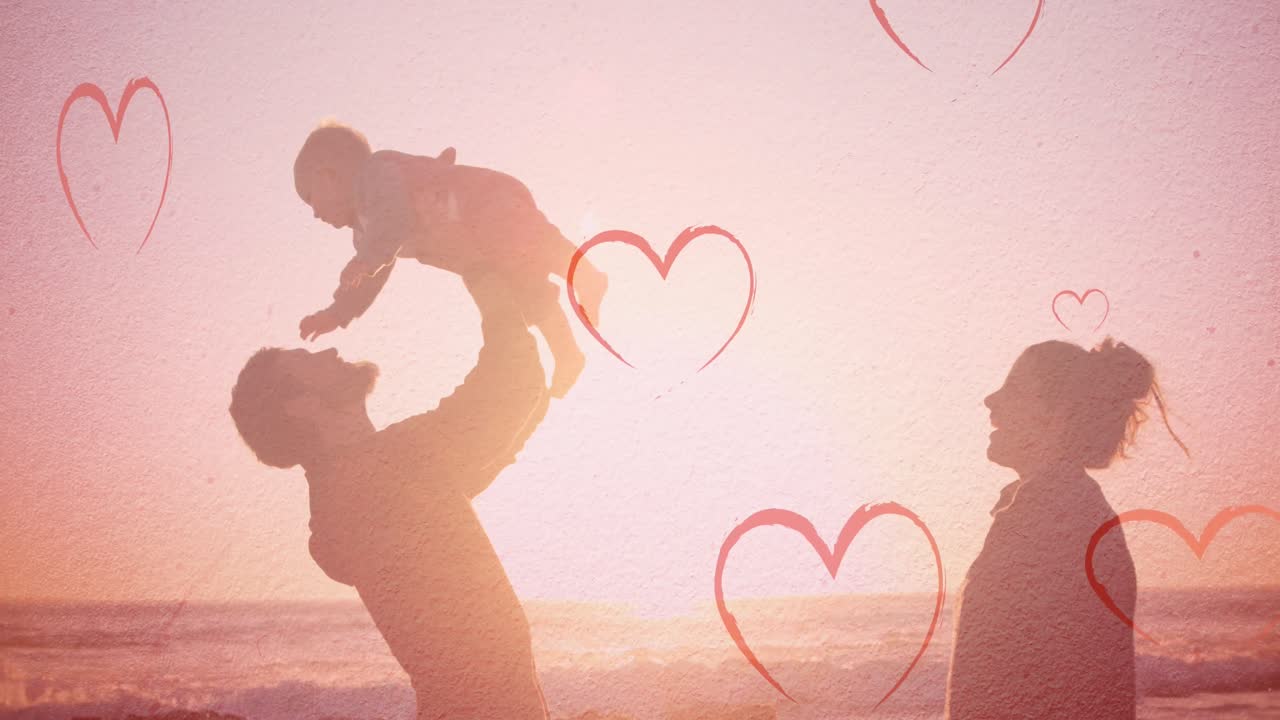 해변에서 백인 가족을 향해 떨어지는 마음의 애니메이션