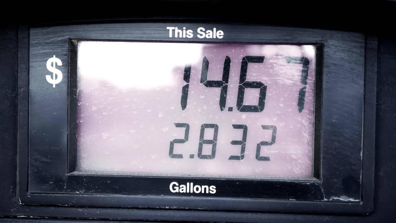 Gas Station Pump Prices High Over 5 Five Dollars Per Gallon 5.15 regular starting at 0 pumping to 69 sped up to be under 60 seconds with dramatic suspenseful camera movements. In Cinema 4K 60fps