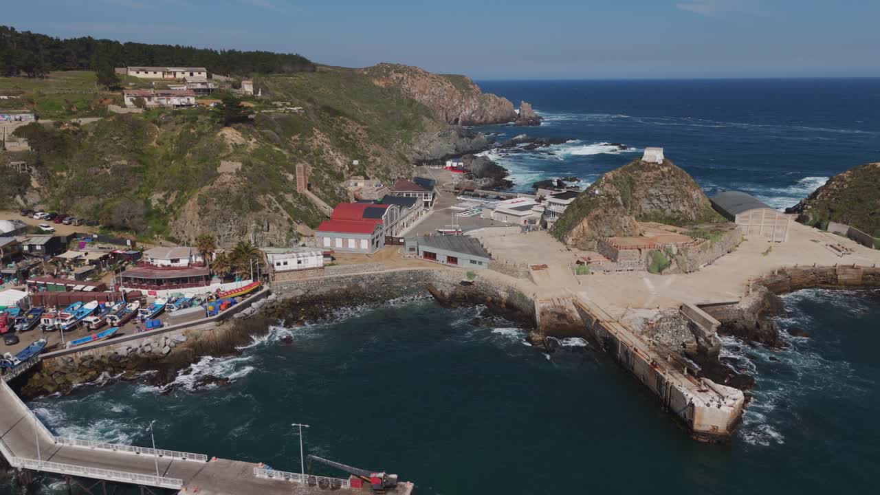 Aerial View of Quintay Museum Foundation, Ex Ballenera Museum, set against the rugged Chilean coastline in Valparaíso, Chile. Dolly Back