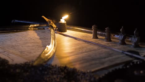 medieval historical sword. accompanied by war map and candle.