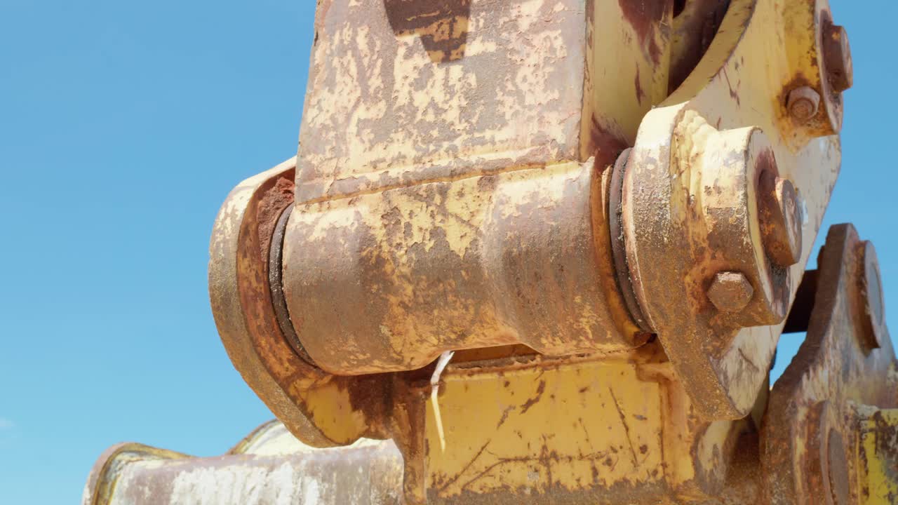 Detail clips of a construction excavator at the beach. Clip 4