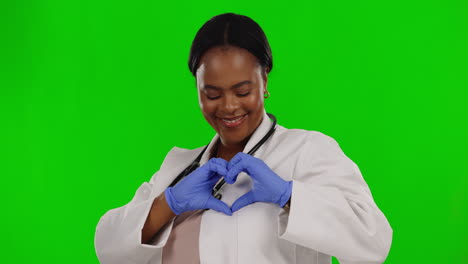 Female-doctor,-heart-sign-and-hands-by-green