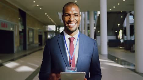 Businessman-looking-at-camera-in-a-modern-office-4k