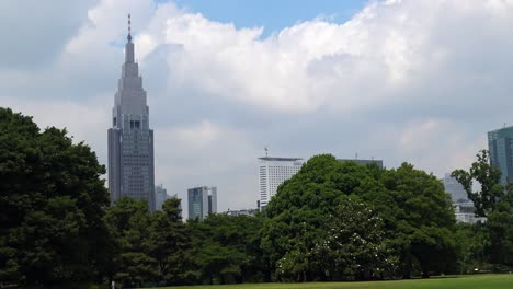 The-view-of-the-skyscraper-with-tree-and-clouds