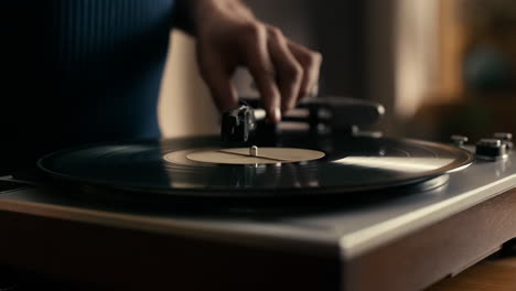 placing a vinyl record on a turntable
