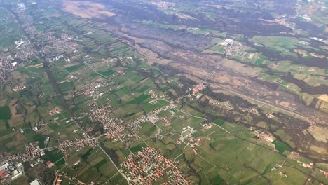 aerial footage of a green, rural area in northern italy