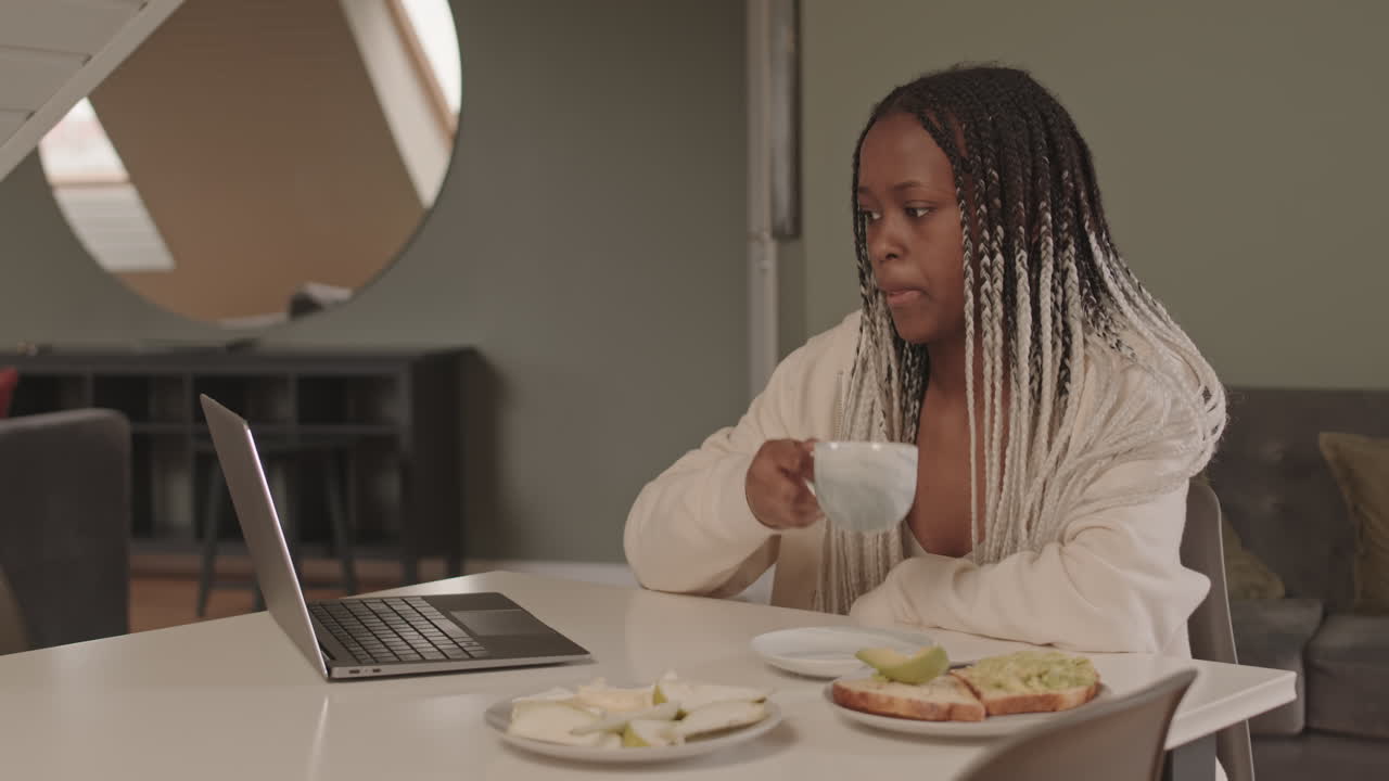 African American Female Freelancer Working from Home