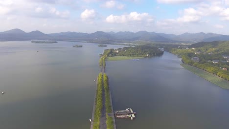 aerial shoot of west lake hang zhou,china  city summer.withe clouds and blue sky.