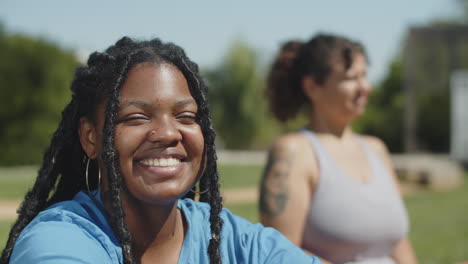 medium shot of african-american female athlete smiling at camera