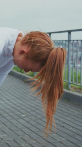 focused athlete taking a break while jogging outdoors, reflecting on her workout experience and upcoming goals in a scenic park environment